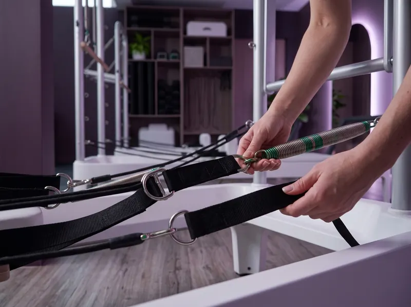 Reformer in Limassol: hands on the reformer straps
