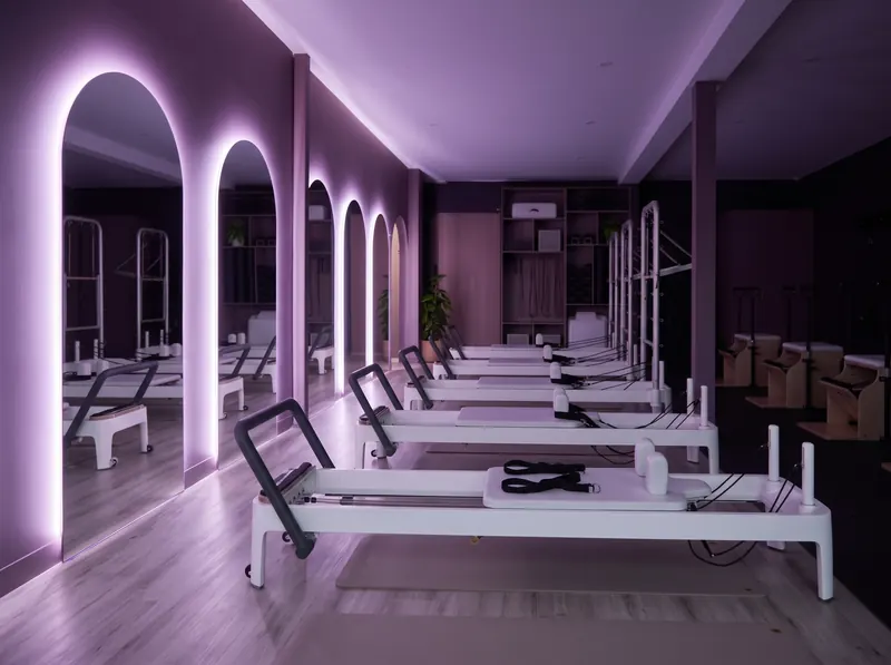 Pilates studio in Limassol: rows of reformers under arched lights